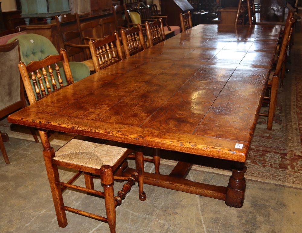 A 17th century style pollard oak extending refectory-style table, 330cm extended (two spare leaves), W.100cm, H.75cm